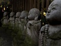 Line of Buddhist statues in a temple in Tokyo, Japan.