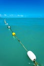 A line of buoys in the blue sea Royalty Free Stock Photo