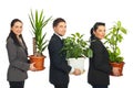 Line of business people holding plants Royalty Free Stock Photo