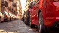 A line of cars parked on a city street, low angle view