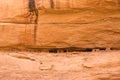 Line of cliff dwellings in desert sandstane wall