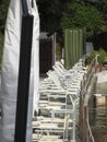 Line of closed beach chairs and umbrellas ready for the next summer season . Tuscany, Italy Royalty Free Stock Photo