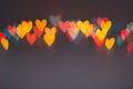 Line of colorful blurred heart shape lights