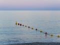 Line of plastic buoys delimit an area in the sea Royalty Free Stock Photo