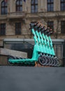 Line of Colorful Scooters on a public street in Bratislava, vertical shot