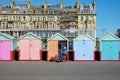 Beach huts and buildings on Brighton promenade Royalty Free Stock Photo