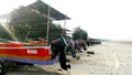 A line of colourful small boats