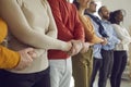 Line of creative team meeting hands together standing in row in office Royalty Free Stock Photo