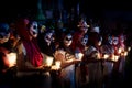 Line of costumed women dressed as Catrinas with skull make-up and candles at the event for dias de los muertos at the Festival Des Royalty Free Stock Photo