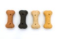 Line of dog biscuits over white Royalty Free Stock Photo