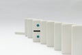 Line of dominos with one standing out from the line. Royalty Free Stock Photo