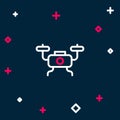 Line Drone flying icon isolated on blue background. Quadrocopter with video and photo camera symbol. Colorful outline Royalty Free Stock Photo
