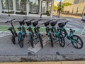 Line of electric bicycles for rent in downtown street