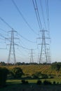 Line of Electricity Pylons across countryside Royalty Free Stock Photo