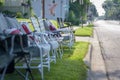 Line of empty chairs set up for fourth of July parade Royalty Free Stock Photo