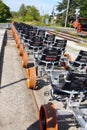 Line of empty rail bikes with orange wheels on a railroad track at the Revolution Rail Company
