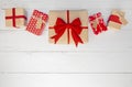 Line of Wrapped Gifts on a White Table Royalty Free Stock Photo