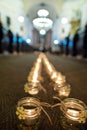 Line of flaming candles in thechurch