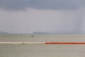 Line of floating orange and white buoys for marking safety zone Royalty Free Stock Photo