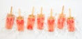 Line of frozen watermelon popsicles or lollies