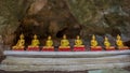 In-line golden Buddha statues in Khao Luang Cave - Phetchaburi, Thailand Royalty Free Stock Photo