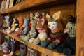 a line of handmade sock puppets displayed on a wooden shelf