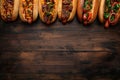 A line of hot dogs served on buns with various toppings, including ketchup, mustard, relish, and onions, ready to be enjoyed