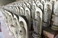 Line of hundreds of Buddha jizo statues at Reisenji Buddhist Temple Royalty Free Stock Photo