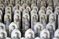 Line of hundreds of Buddha jizo statues at Reisenji Buddhist Temple Royalty Free Stock Photo