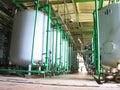 Line of industrial chemical tanks at power plant Royalty Free Stock Photo