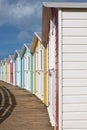 Line of locked English seaside chalets out of season Royalty Free Stock Photo