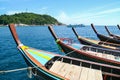 Line of long tail boat Ruea Hang Yao tied together in the sea