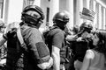 Militia Members in Combat Gear Move Through a Crowd Towards a Counter Protestor