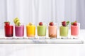 a line of mini smoothie shots with different flavours