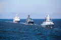 A line of modern russian military naval battleships warships in the row, northern fleet and baltic sea fleet in the open sea Royalty Free Stock Photo