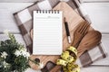 Line Notepad on chopping board with wooden fork and spoon and th