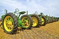 A line of old John Deere tractors Royalty Free Stock Photo