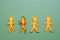 Line of paper figures with one crumpled. Rejection and individuality. Royalty Free Stock Photo