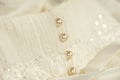 Line of pearl buttons on a wedding dress Royalty Free Stock Photo