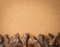 Line of Pine Tree Bark Chip on Brown Cork Board Background Royalty Free Stock Photo