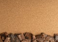 Line of Pine Tree Bark Chip on Brown Cork Board Background Royalty Free Stock Photo