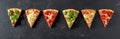 Line of pizza portions with a variety of trimmings Royalty Free Stock Photo