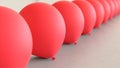 Linear Array of Red Balloons on a Light Gray Surface