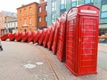 Line of red call boxes on the street of London UK Royalty Free Stock Photo