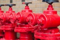 A line of red fire hydrants in Guangzhou, China