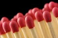 Line of red matchsticks on black background Royalty Free Stock Photo