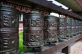 Line of religious prayer wheels