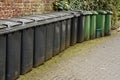 Line of residential wheelie bins Royalty Free Stock Photo