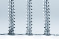Line of silver screws toned grey Royalty Free Stock Photo