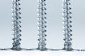 Line of silver screws toned grey Royalty Free Stock Photo